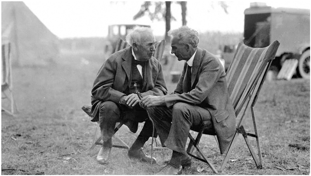 a picture of edison and ford talking to each other intimately